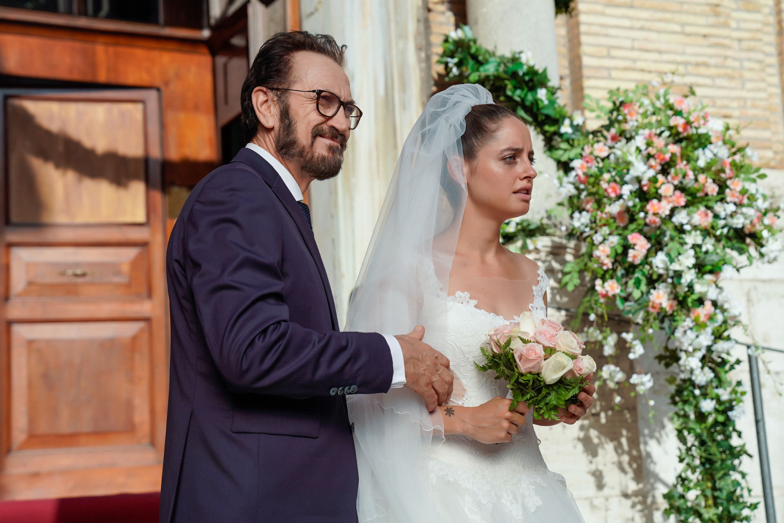A scene from the Italian film Three Perfect Daughters, featuring a bride and her father.