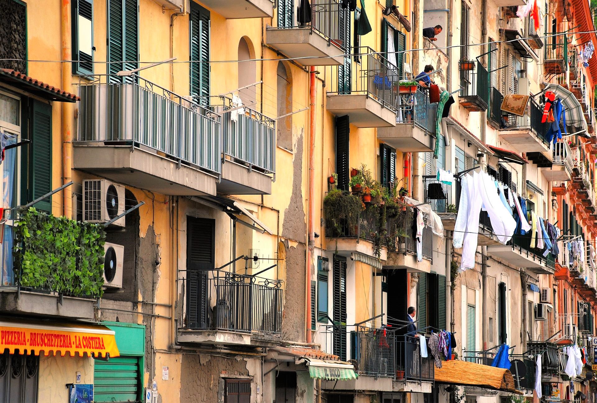 The colourful walls of the apartments in Naples, where washing lines adorn the balconies.
