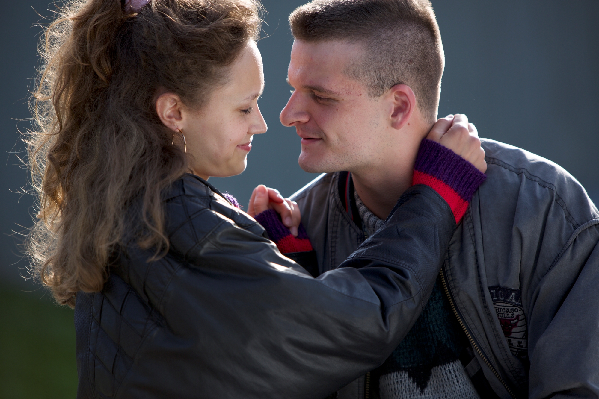 A young Lithuanian couple in warm clothing in an intimate embrace